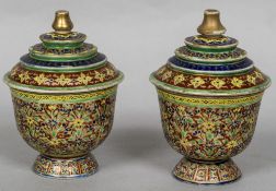 A pair of antique Eastern porcelain vases and covers The removable lids of stepped form with gilt