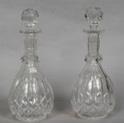 A pair of 19th century cut glass decanters and stoppers Of baluster form. 26.5 cm high overall.