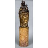 A 19th century Continental carved giltwood Madonna and child Standing on a turned marble plinth