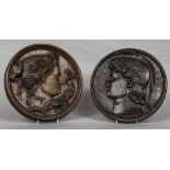 Two late 19th century carved oak roundels One depicting the bust in profile of a classical young