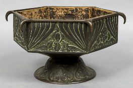 An Arts & Crafts copper jardiniere Of hexagonal font form with stylised foliate decoration.