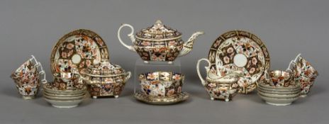 A 19th century Crown Derby ten setting tea service Decorated in the Imari palette,