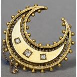 An unmarked 18 ct gold and diamond set brooch Of crescent form set with three diamonds. 3.