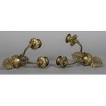 A pair of French Empire gilt bronze wall sconces Each pierced back issuing twin branches.