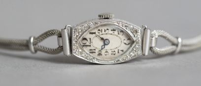 A Swiss Art Deco diamond set platinum cased lady's cocktail watch with 9 ct white gold strap The