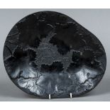 An unusual 19th century dish, possibly slate Worked with foliate vines. 30 cm wide.