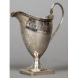 A George III silver cream jug, hallmarked London 1799,