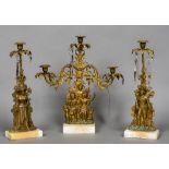 A 19th century American gilt metal candle lustre triple garniture by Cornelius & Co The central