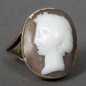 An antique unmarked gold carved hardstone cameo ring Centrally set with a carved classical bust. 2.