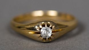 An 18 ct gold gypsy set diamond solitaire ring The stone approximately 1/8th of a carat, cased.