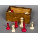 An early 20th century ivory and stained ivory Staunton pattern chess set The Kings approximately 6.