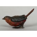 An Austrian cold painted bronze bird Worked with a red breast and tail feathers, stamped Geschutzt.