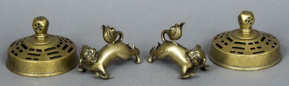 A pair of Chinese bronze dogs-of-fo Typically modelled on all fours;