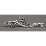 A Georg Jensen Danish Sterling silver brooch Of beaded scrolling form, stamped number 275.