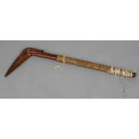A carved wooden New Caledonia tribal club The blade of bird beak form,
