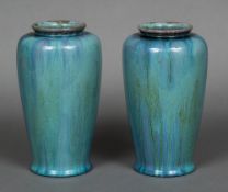 A pair of Pilkingtons Royal Lancastrian pottery vases Each with allover streaky turquoise glaze,