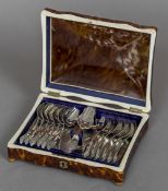 A 19th century tortoiseshell and ivory box Of hinged dome serpentine form housing a set of thirteen