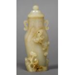 A Chinese carved pale and russet jade twin handled vase and cover The body worked with a salamander