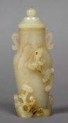 A Chinese carved pale and russet jade twin handled vase and cover The body worked with a salamander