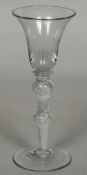 An 18th century air twist wine/gin glass The trumpet bowl with double knop stem and conical foot.