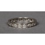 An 18 ct white gold eternity ring Of typical form.