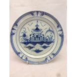 A late 18th century English pearlware plate Centrally decorated with a chinoiserie pagoda. 23.