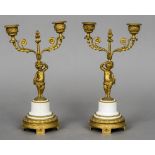 A pair of Empire gilt bronze and marble candelabra Each with scrolling twin branches above the