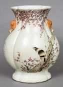 A Chinese porcelain baluster vase Of lobed section, decorated with a bird amongst blossom,