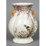 A Chinese porcelain baluster vase Of lobed section, decorated with a bird amongst blossom,