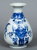 A Chinese blue and white porcelain baluster vase Worked with precious objects. 19 cm high.