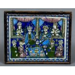 A large 19th century Qajar tile Worked in bright enamels with dignitaries at a feast with