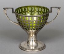 A WMF silver plated twin handled cup and green glass liner The bowl pierced. 12.5 cm high.