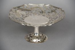 A Chinese pierced silver tazza Decorated with dragons amongst clouds,