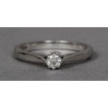 A platinum diamond solitaire ring The single claw set stone above pierced shoulders.