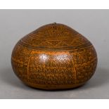 A carved gourd, probably South American Decorated in the round with figural processions and animals.