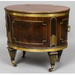 An early 19th century brass bound and inlaid mahogany cellaret Of oval form,