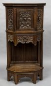 A 19th century Flemish carved oak cupboard With a single door,