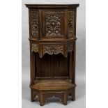 A 19th century Flemish carved oak cupboard With a single door,