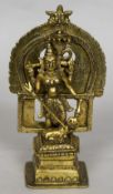 An Eastern gilt bronze model of a deity Modelled standing spearing a mythical beast. 17.5 cm high.