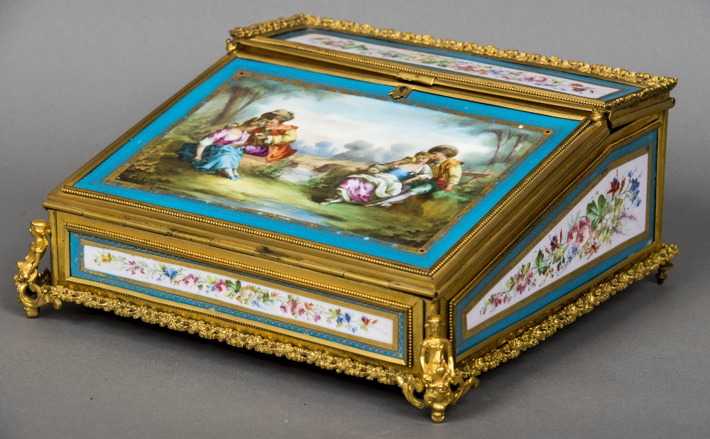 A 19th century ormolu mounted porcelain inset writing slope Inset with Sevres type painted