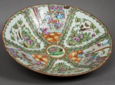 A large late 19th century Cantonese famille rose dish Typically decorated with figures in interiors