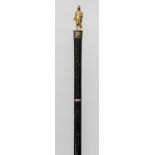 A 19th century gilt metal mounted ebonised cane The finial formed as a naval officer. 77 cm long.