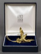 A boxed Astwood Dickinson 18 ct gold brooch Formed as a bird of paradise. 8 cm wide.