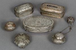 A 19th century Eastern unmarked silver box Of hinged oval form decorated with floral scrollwork;