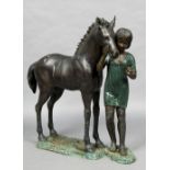 A large patinated bronze model of a girl with a pony The base with a plaque inscribed Bronze Elite