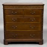An early 20th century mahogany chest of drawers The moulded canted rectangular top above a blind