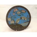 A 19th century Japanese cloisonne plate Typically decorated with cranes in a river landscape within
