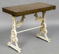 A Victorian copper topped cast iron garden table The studded beaten copper top above scroll cast