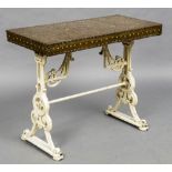 A Victorian copper topped cast iron garden table The studded beaten copper top above scroll cast