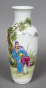 A Chinese porcelain vase Decorated with figures in a continuous landscape opposing calligraphic